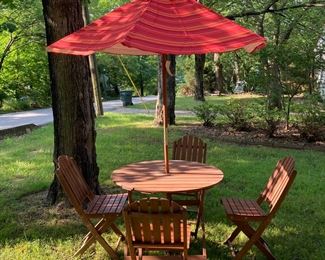 Teak table, 4 chairs and new umbrella 