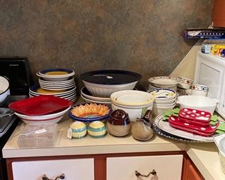 Beautiful pottery bowls and serving pieces. Salt and pepper shakers. 