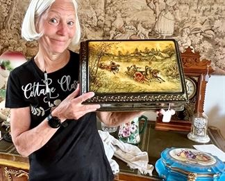 Barbara holding up a huge Russian lacquer jewelry box. 