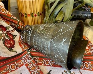 Notice the Middle Eastern camel bell. 