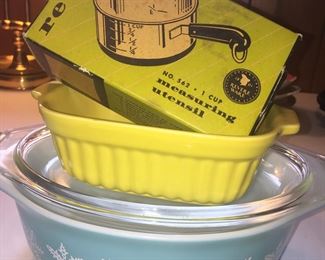 An often sought Pyrex snowflake casserole dish, a newer yellow baking dish and vintage RevereWare measure are great ways to add old-fashioned charm yo any kitchen. 