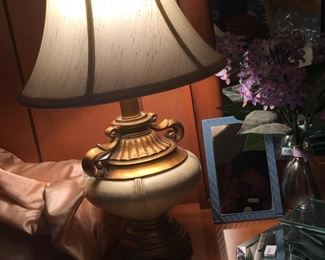 A small but hefty lamp teams nicely with a dresser set mirror, brush and comb. 