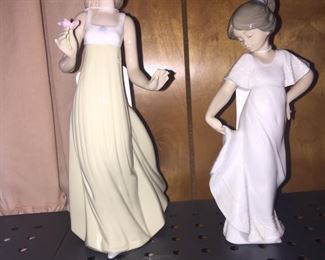 Lladro figurines feature pastel colors and graceful motion. Well ... maybe even a not-so-graceful fall as the larger miss has broken fingers. 
