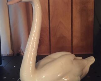 A Lladro swan looks as if it could float on a lake or pond. 