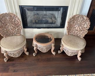 Two imported solid wood hand carved chairs and matching table 