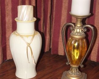 Two Different But Similar Candle Holders With Candles