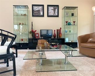 2 Glass display cabinets with locking doors and lighted inside.