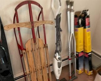 Antique sled, mop, crutches