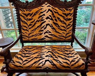 Very cool tiger Settee with Wood Carving. This is a Conversation piece that will ve treasured. 