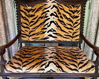 Amazing  tiger Settee with Wood Carving. This is a Conversation piece that will treasured for years.