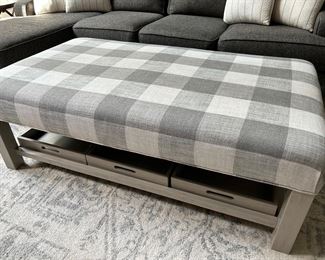 gray and white check ottoman with underneath tray storage. 4'8" x 2'8"