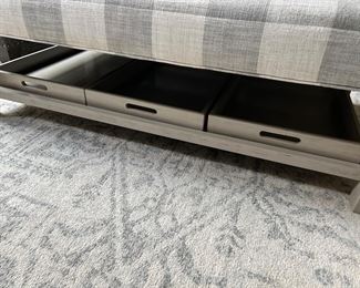 (storage trays under the ottoman)