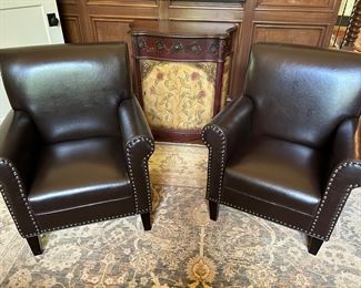 2 black leather arm chairs by Nobel House Home