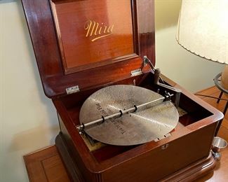 Rare antique Mira music box disc player with mahogany case and several additional record albums! Plays absolutely beautifully.