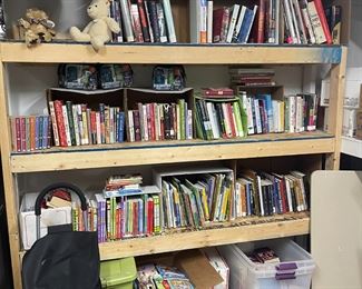 Joy dedicated turning her garage into a library for kids K-12. Truly ranges, most teen books are on the top shelves. Several in Spanish as well. I personally opened several boxes shipped directly from Scholastic of new books.