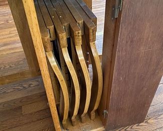 F13 - $50. Drop leaf table on wheels that stores 4 folding chairs inside. Measures 10.25" wide with leaves down. 34" long x 29.5" tall. Each leaf adds 25.5" (61" long with leaves up)