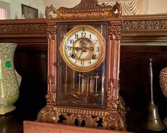 D4 $275. Waterbury Mantle Clock. 4 sided glass case. Measures 8.5" square at base x 13.5" tall. Beautiful statement piece!