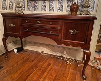 F10 - $150. Cherry Finish Sideboard. Measures 20" deep x 59" long x 34.5" tall. 