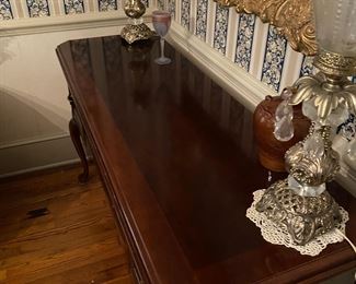 F10 - $150. Cherry Finish Sideboard. Measures 20" deep x 59" long x 34.5" tall. 