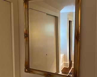 W23 - $40. Heavy Gold Framed Mirror. Measures 28.5" x 39.5". 