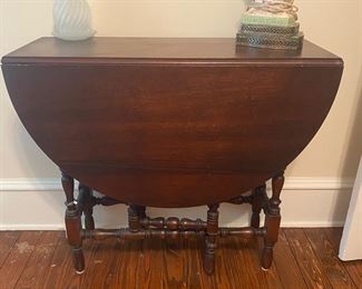 F22 - $50 small drop leaf table measures 14" wide with leaves down x 34" long x 30" tall. Each leaf adds 17".  Solid wood and sturdy. 