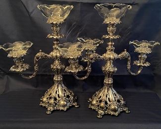 D25 - $850 Reed & Barton pair of candleabras with glass inserts. 16” wide x 16” tall (not counting glass) 