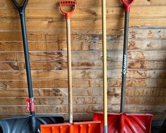 Three Plastic Snow, Shovels, And One Metal Snow Shovel