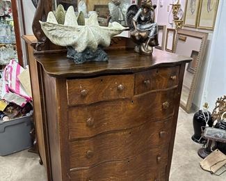 One of two oak serpentine chest