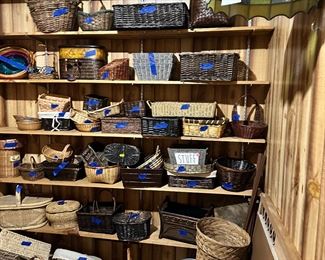 Storage room full of baskets.  All sizes and shapes.  Stained Glass light fixture is not for sale.
