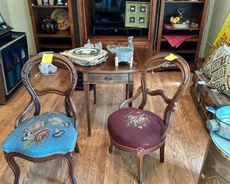 Balloon back chairs with beautiful needlepoint seats.  Demilune table.  Wonderful pair of carved side tables from Hawaii 