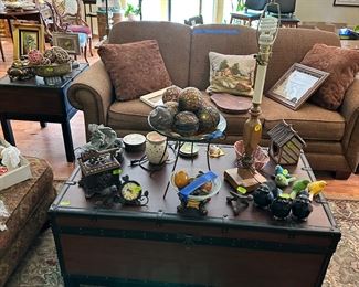 Sofa with unusual trunk coffee table and side table.  Another beautiful rug for sale
