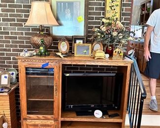 Oak entertainment center.  Side door with beveled glass.  Ralph McDonald "Chairman of the Board" print,  Lamps Galore!!!
