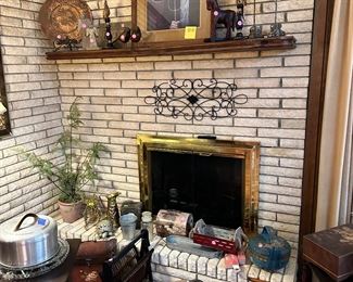 "American Gothic" print by Grant Woods which is custom framed.  More unusual decor.  Vintage cake plates and cover.  More copper.  