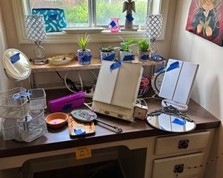 Make up mirrors, make up storage, lots of vanity items, another original painting.  adorable crystal lamps. 