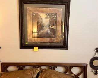 Walls full of artwork, more accent pillows and bedding set