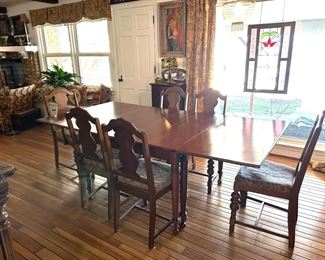 Drop leaf table and chairs.  5 side chairs with 1 arm chair.