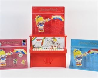 30: 4PC 1983 Rainbow Brite Toy Piano Bank Group