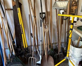 Assortment of Rakes and Shovels