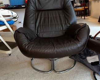 Danish modern swivel chair with ottoman. 