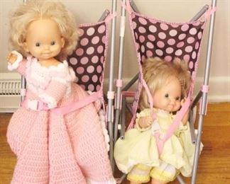 73 - Dolls and Doll Strollers 16" x 11" x 24"
