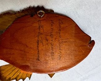 Signature on Wooden back of fish