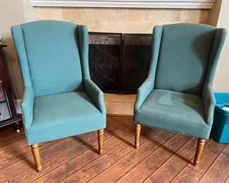 Pretty teal blue chairs. Notice the fireplace screen.