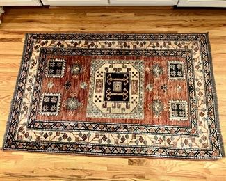 Hand knotted wool rug 
58” x 38”

