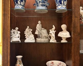 The figurine on the left on the second shelf and bowl is sold.