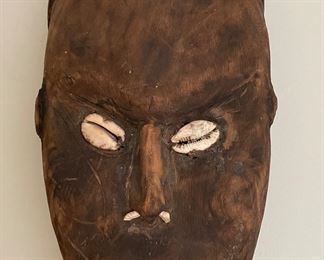 Hand-Carved Papua New Guinea Primitive Sculpture of Man with Cowrie Eyes. Measures 9" W x 44" H. Photo 2 of 3.