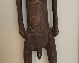 Hand-Carved Papua New Guinea Primitive Sculpture of Man with Cowrie Eyes. Measures 9" W x 44" H. Photo 3 of 3.