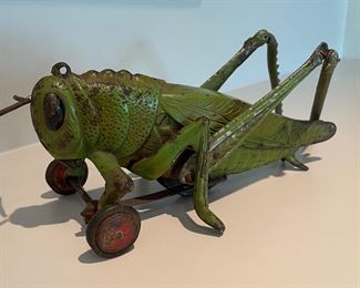 Cast Iron Grasshopper on Wheels Needs Repair of Leg. Photo 1 of 2.
