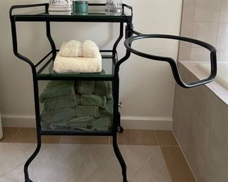 Metal Toiletry Cabinet with Swing Arm Towel Holder. Measures 20.5" W x 18" D x 34" H.
