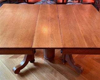 Oak Pedestal Dining Table. Measures 44" W x 60" L With Leaf x 30" H. Photo 2 of 6.