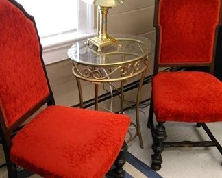 Pair cushioned side chairs with metal/glass table and brass lamp